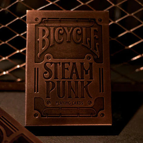 A pack of Bicycle brand playing cards with a Steampunk design, featuring bronze paper and intricate mechanical illustrations.